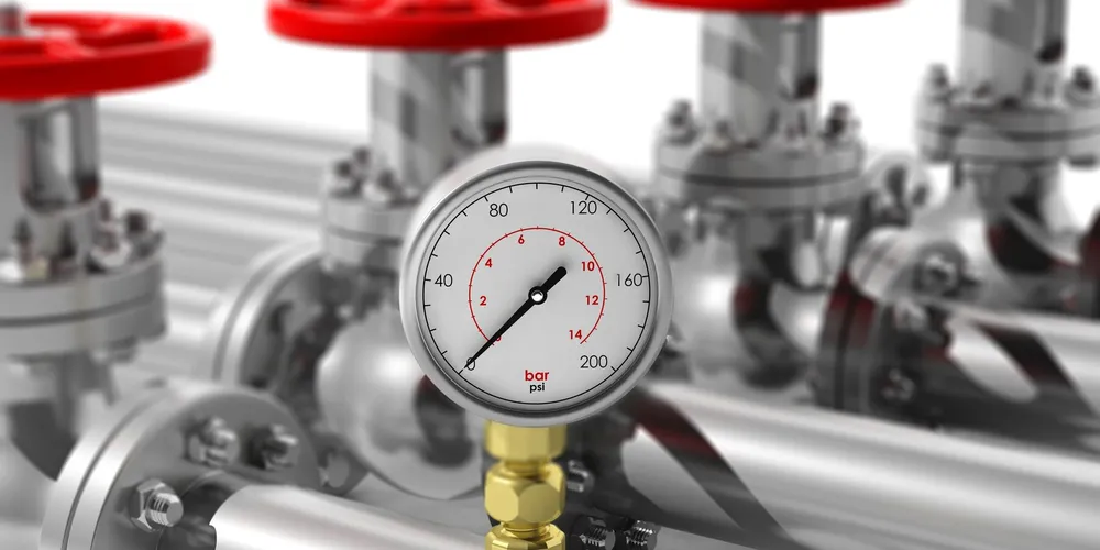 Water system pressure gauge and valves — illustrative stock photo of well water system components, not an actual Pahrump installation
